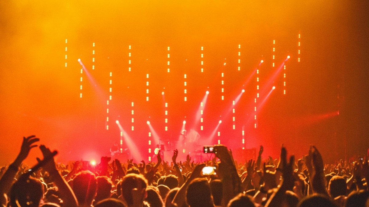 Live entertainment stage lighting and audience environment.