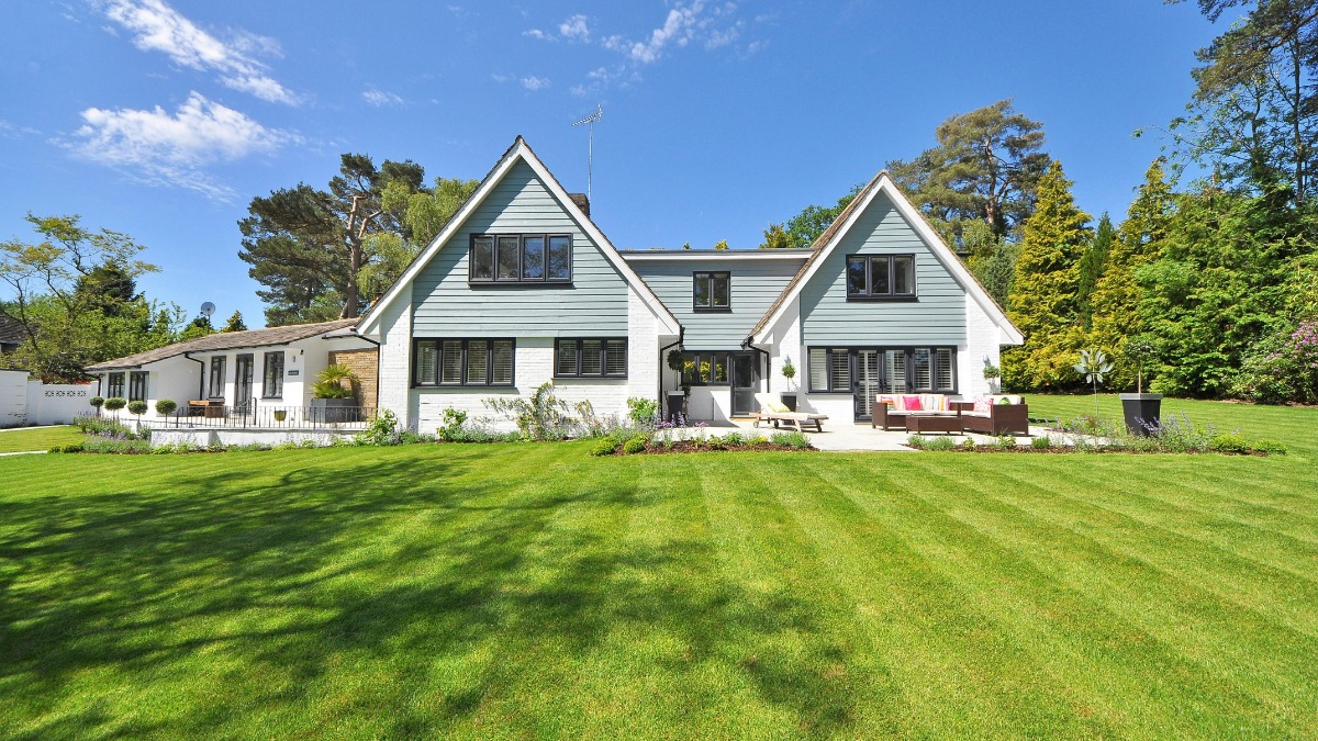 Front yard landscaping with clean edging, shrubs, and a gravel path to improve curb appeal.